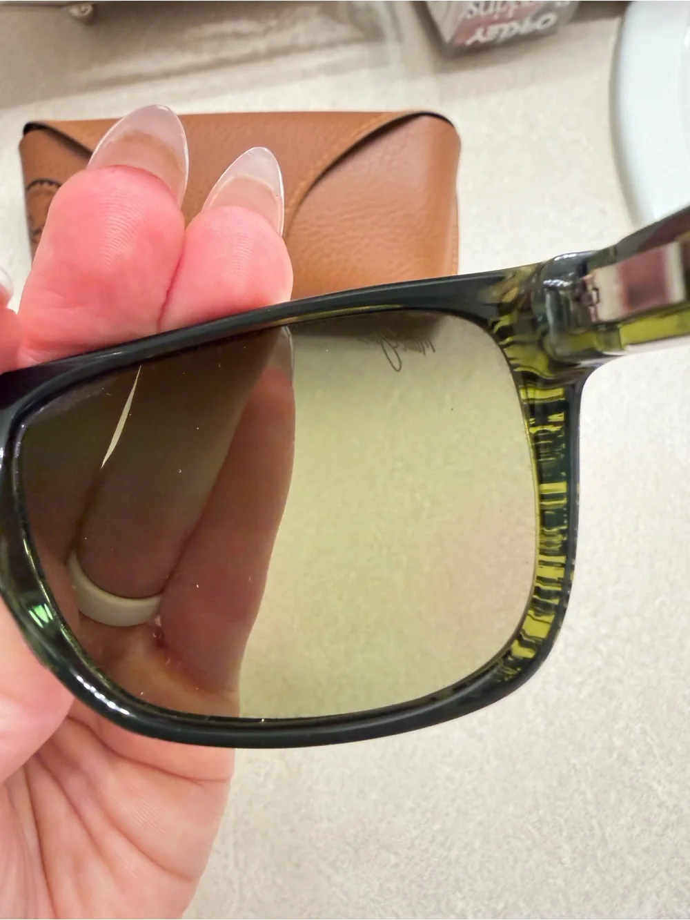 Maui Jim Black Frame Sunglasses with Green-Tinted Lenses